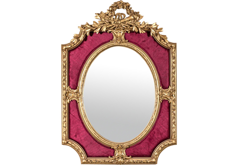 A spectacular and unique French mid 19th century Louis XVI period style finely carved double frame giltwood velvet upholstered overmantel mirror, The oval beveled mirror plate is set within a giltwood frame with laurel and moulded carvings, Surrounded at the four cardinal points with acanthus C scrolled escutcheons on an upholstered background of fine red velvet fabric, The outer rectangular frame is concavely broken on each corner and carved with laurel wrath trailing husks connected to the escutcheons in question and each connecting point with a volutes, acanthus and ribbons, The very impressive top crown is adorned with delicately perforated pediment attributes of quiver of arrows and eternal flame of prosperity and splendid tied ribbon amidst stunning and highly detailed carved flowers, blossoms and swaging floral garlands issuing two laurel wreath branches dangled to each concave side